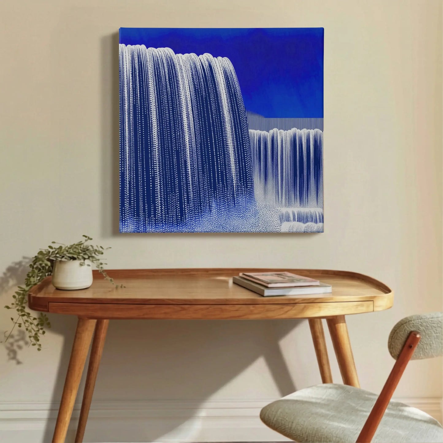Motivational canvas wall art in home office, waterfall print with dried florals and warm-toned vase on timber console