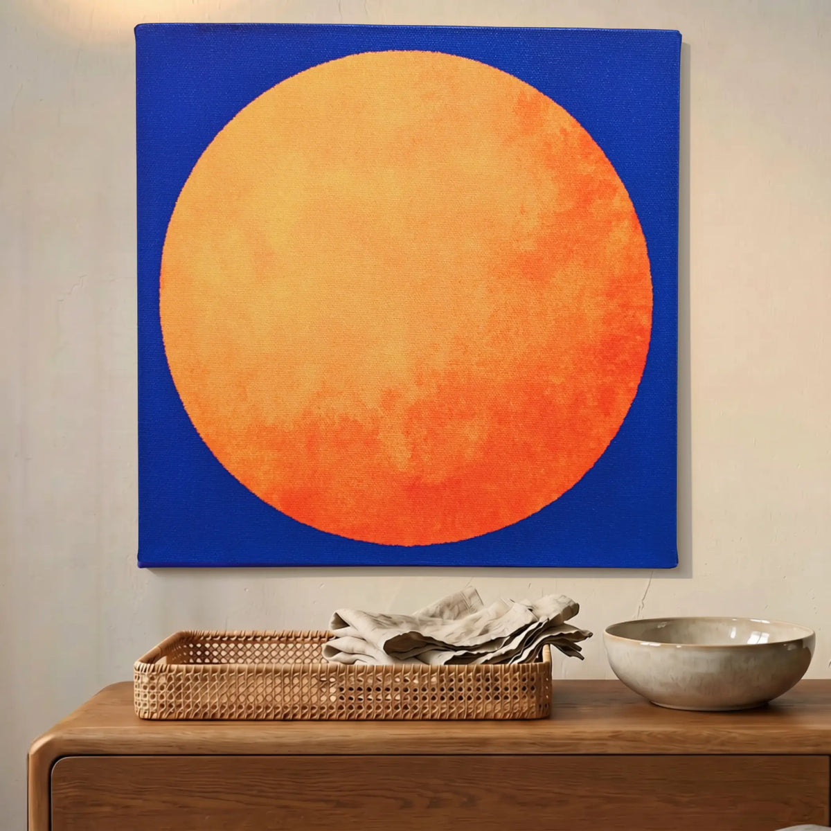 Orange and blue rising sun abstract canvas wall art, RISE Sun, on a wall at home