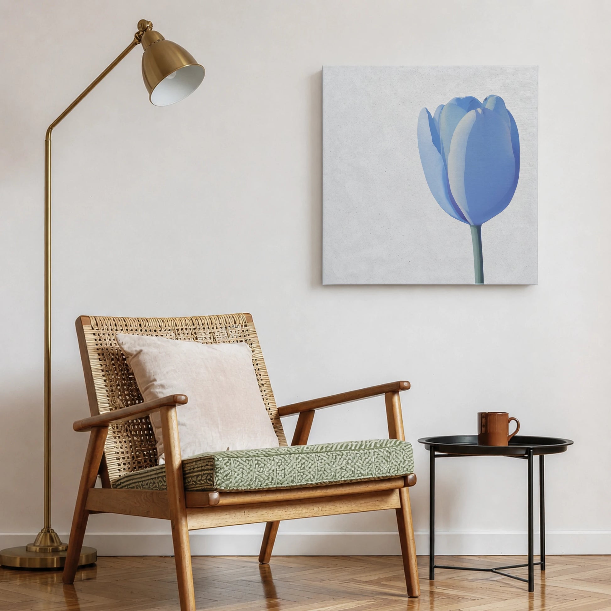 Blue wall art tulip print in reading nook with woven accent chair, brass floor lamp, and indoor plant