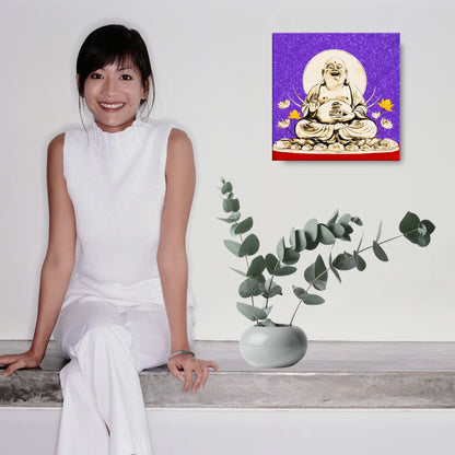 Woman sitting on floor with laptop and Buddha painting on wall, peaceful room decor.