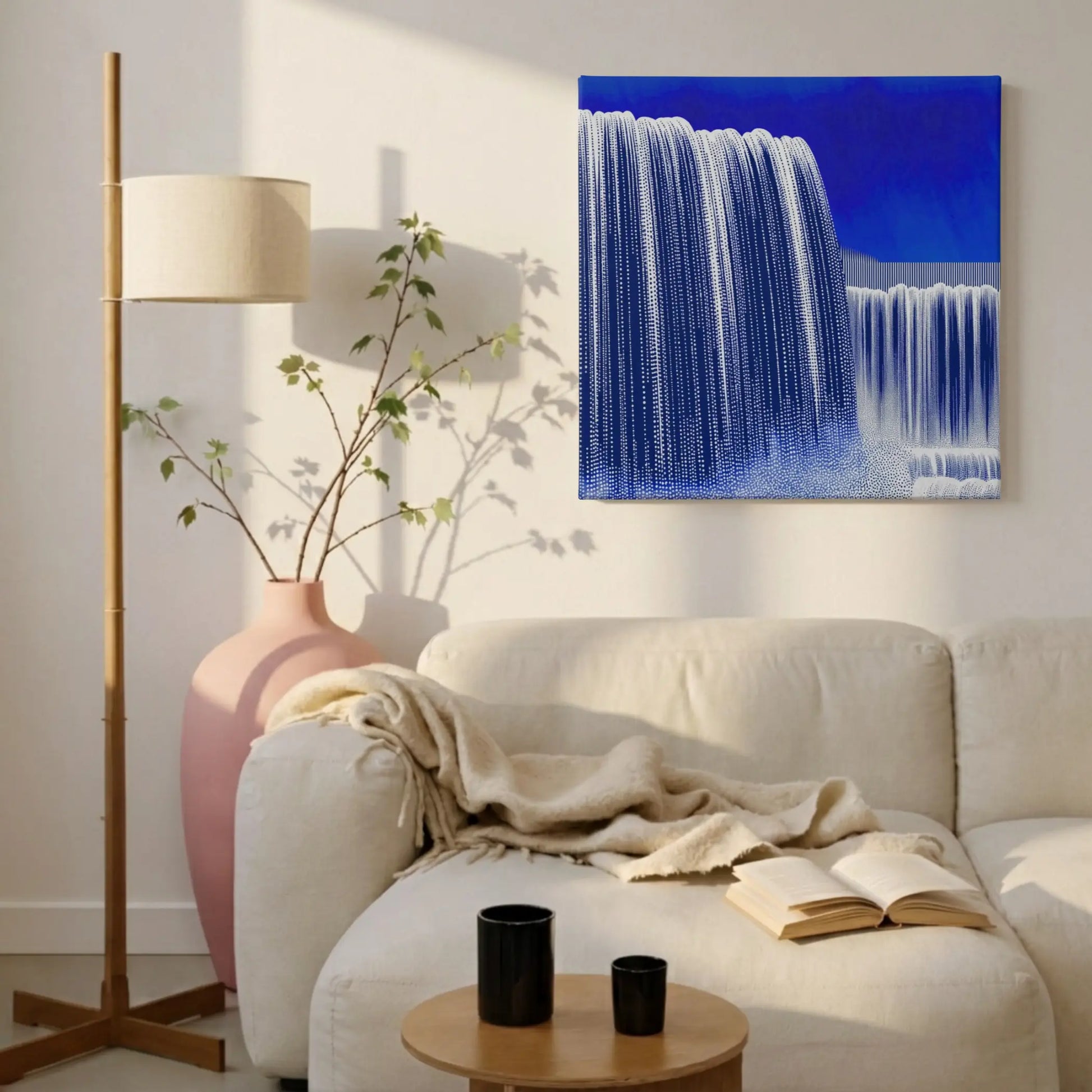 Feel unstoppable with waterfall canvas wall art in calm living room with linen sofa, knit throw, and indoor plants