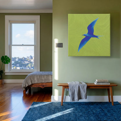 Green wall art bird canvas in bedroom with sage green wall, blue rug, and warm timber furniture