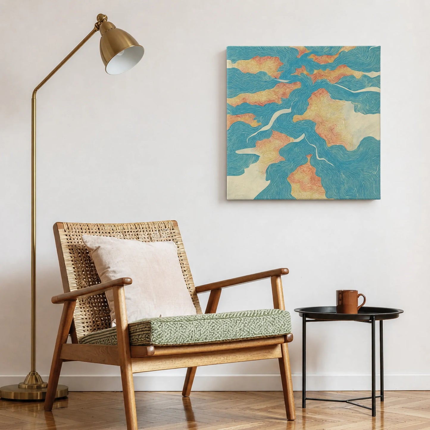 Inspirational canvas wall art river map in reading nook with woven accent chair, brass lamp, and warm textures