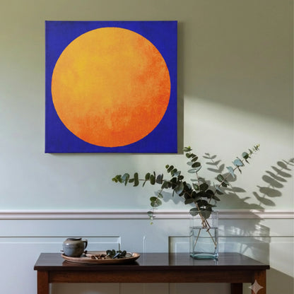 Motivational wall art for living room, sun canvas with dark timber furniture, indoor plants, and natural light
