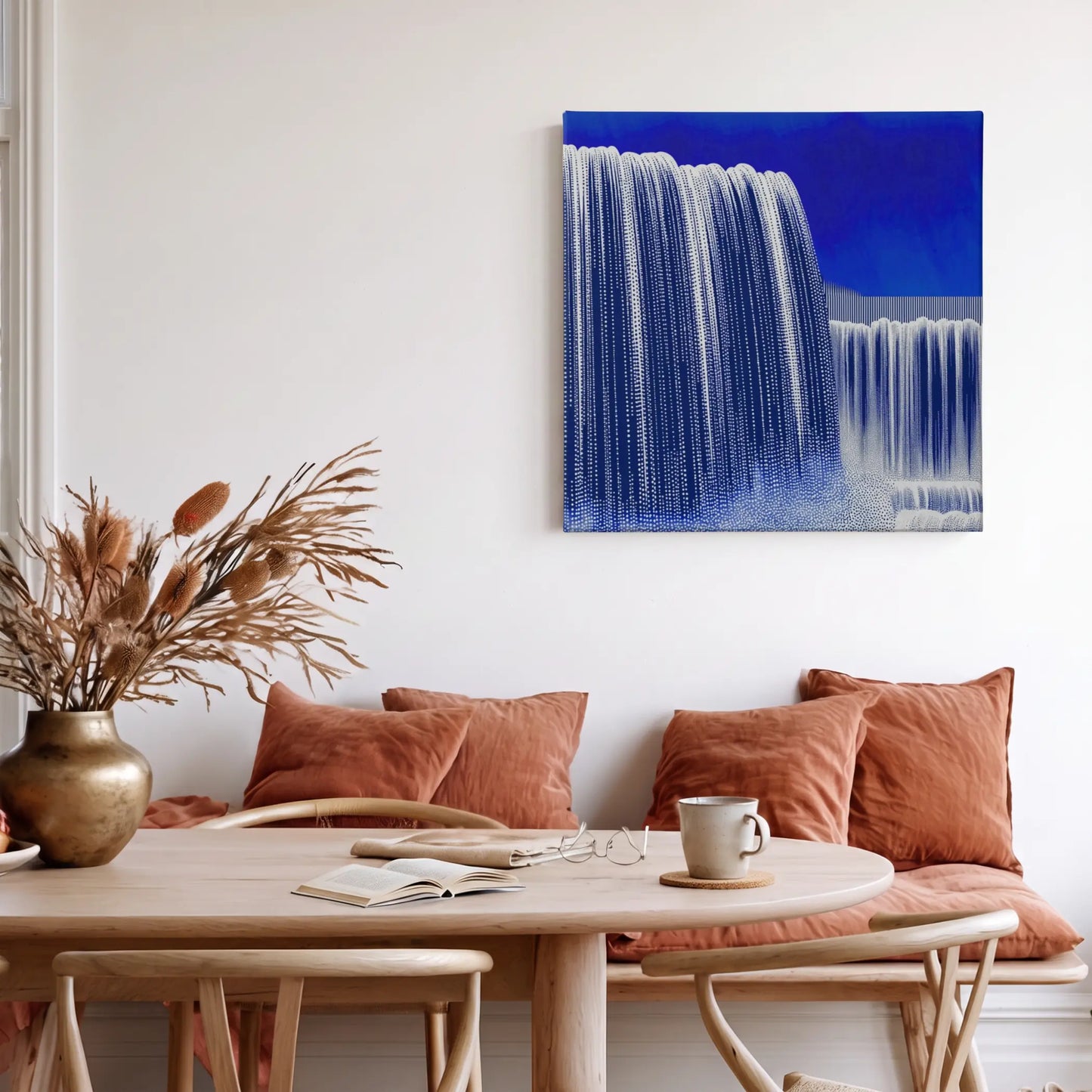 Motivational wall art waterfall canvas in warm dining room with terracotta cushions and natural textures
