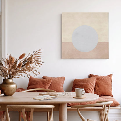 Peaceful wall art moon canvas in warm dining area with terracotta cushions and dried pampas
