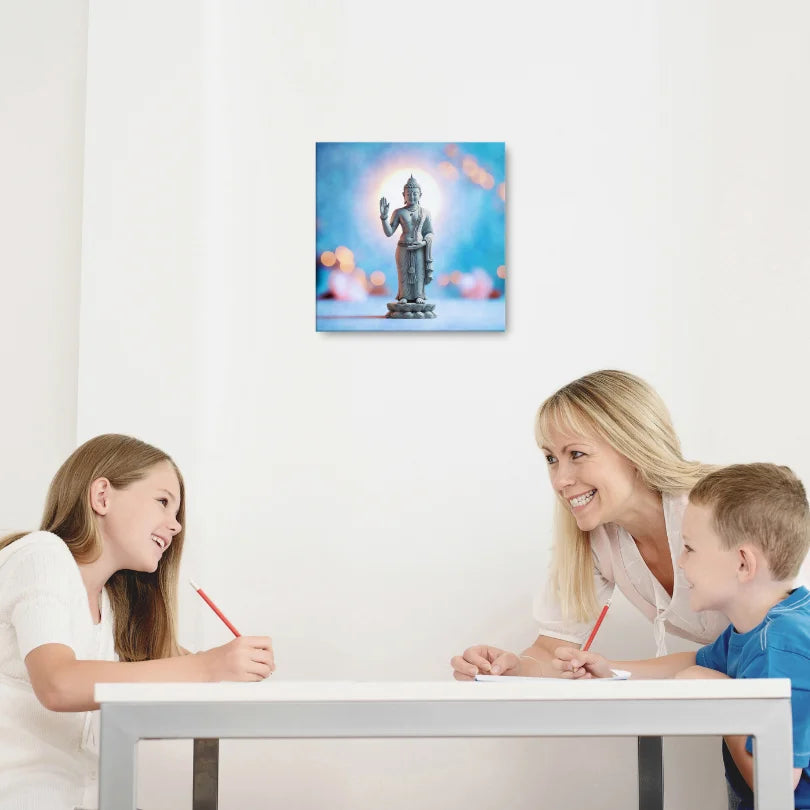 Woman reading a book on a couch with Buddha wall art, feng shui home decor.