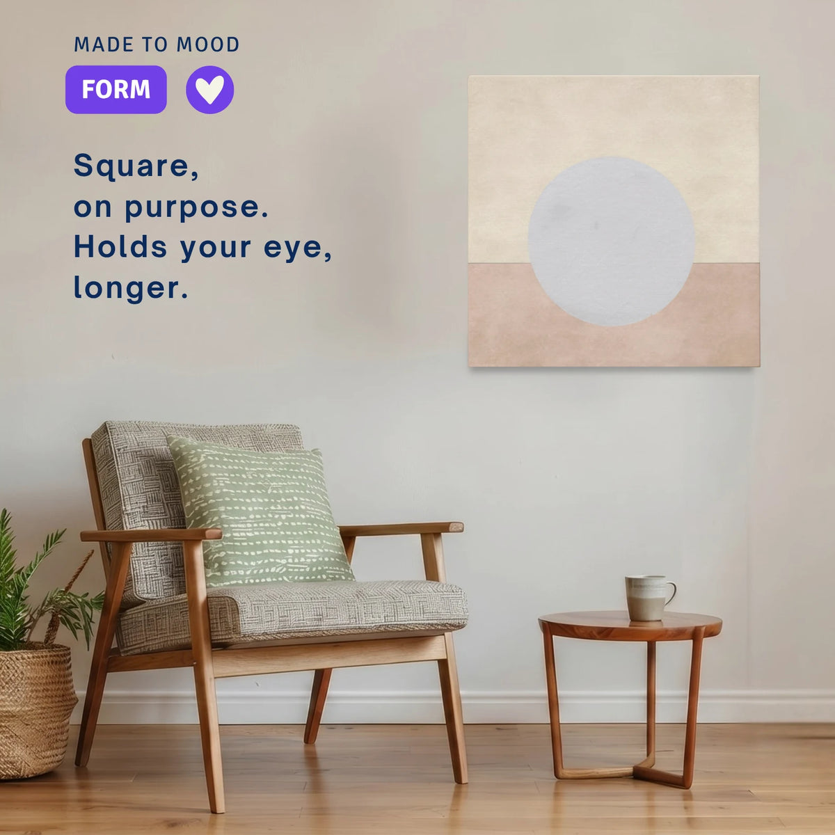 Square modern canvas wall art: ENOUGH Moon hung beside an armchair in a calm room